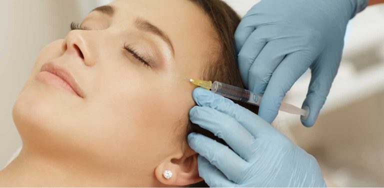 a woman getting a Dysport injection to treat her wrinkles