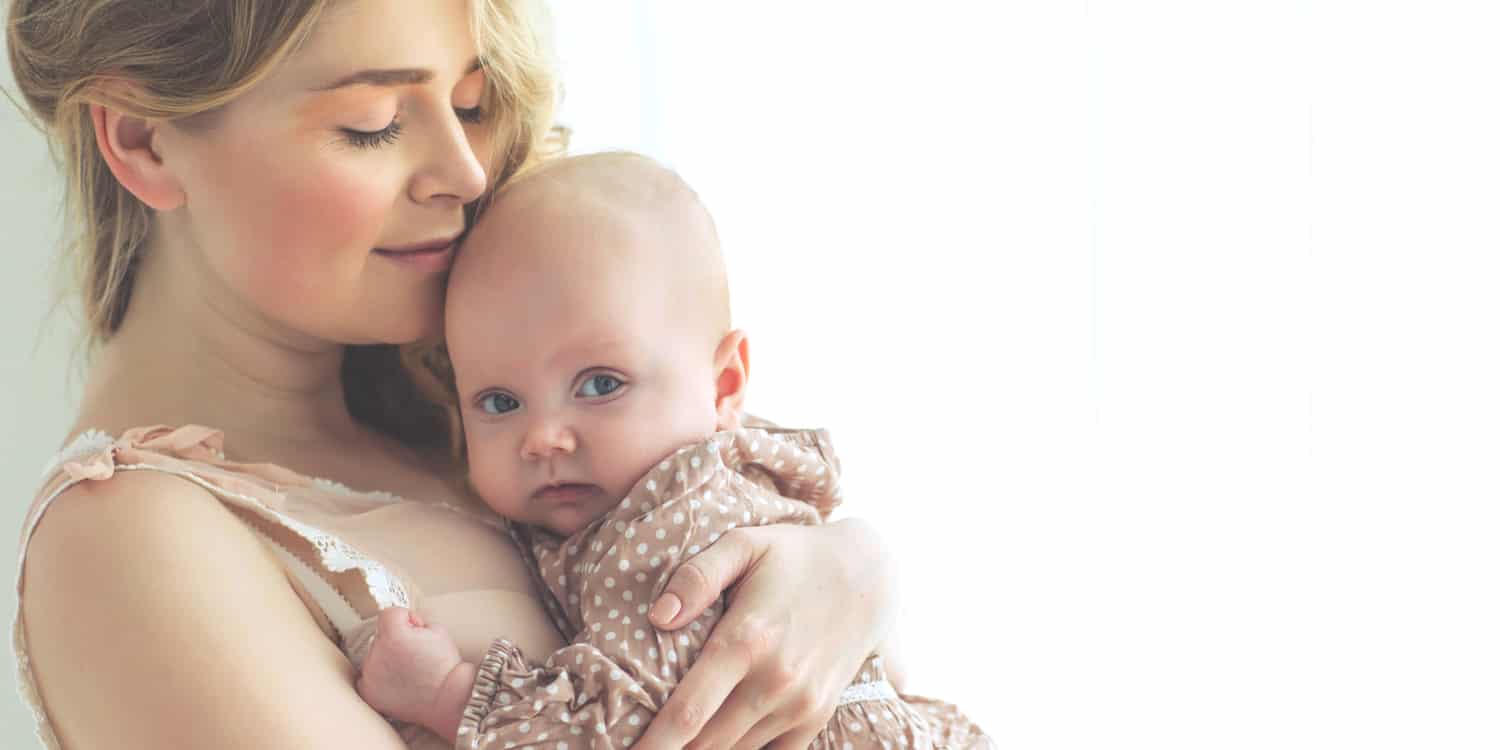 A new mom who might be interested in a mommy makeover after pregnancy