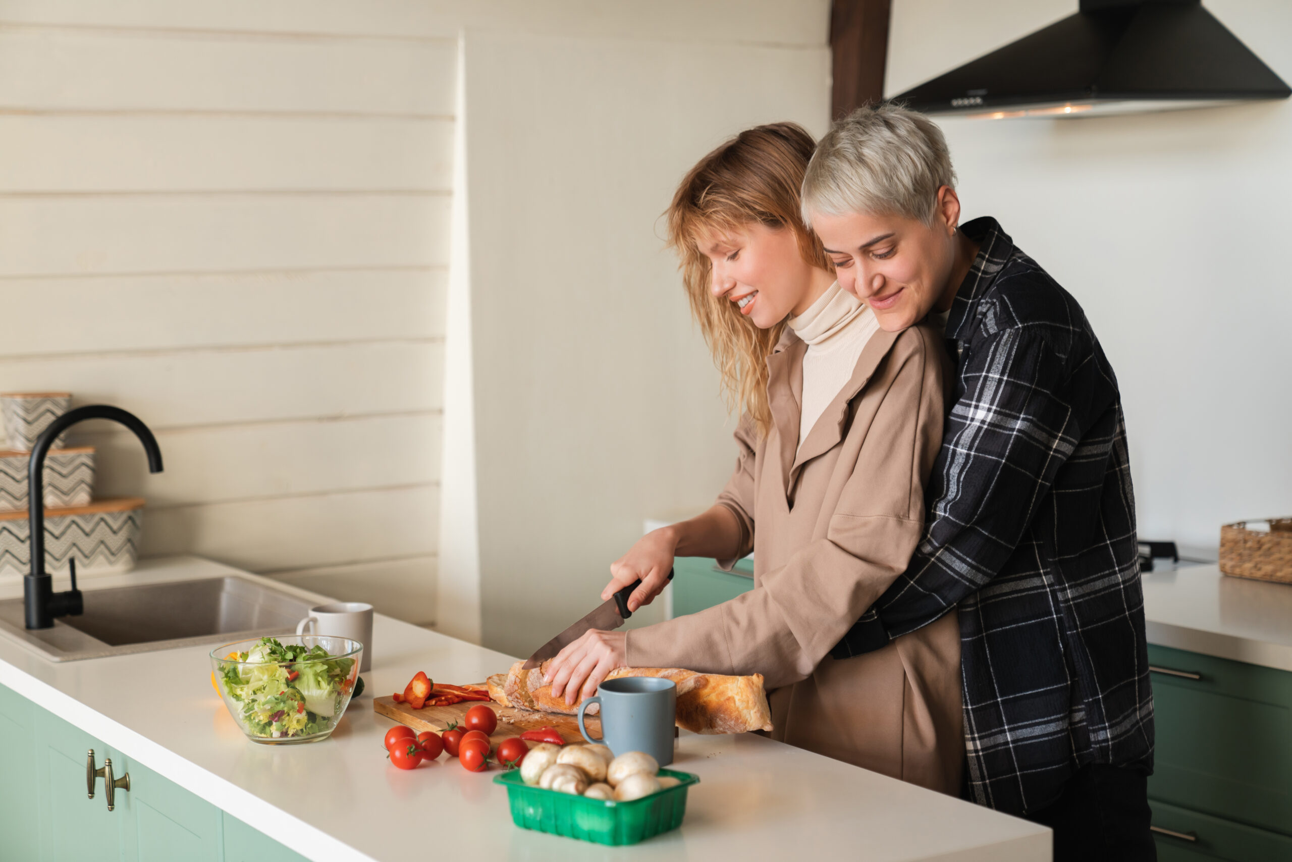 a couple in an embrace in the kitchen